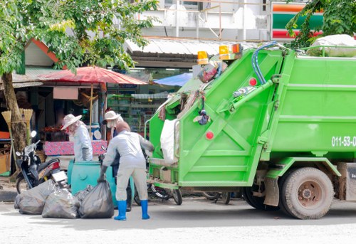 House clearers organizing items for disposal in Plumstead
